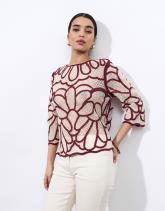 Pull fin court uni décoré